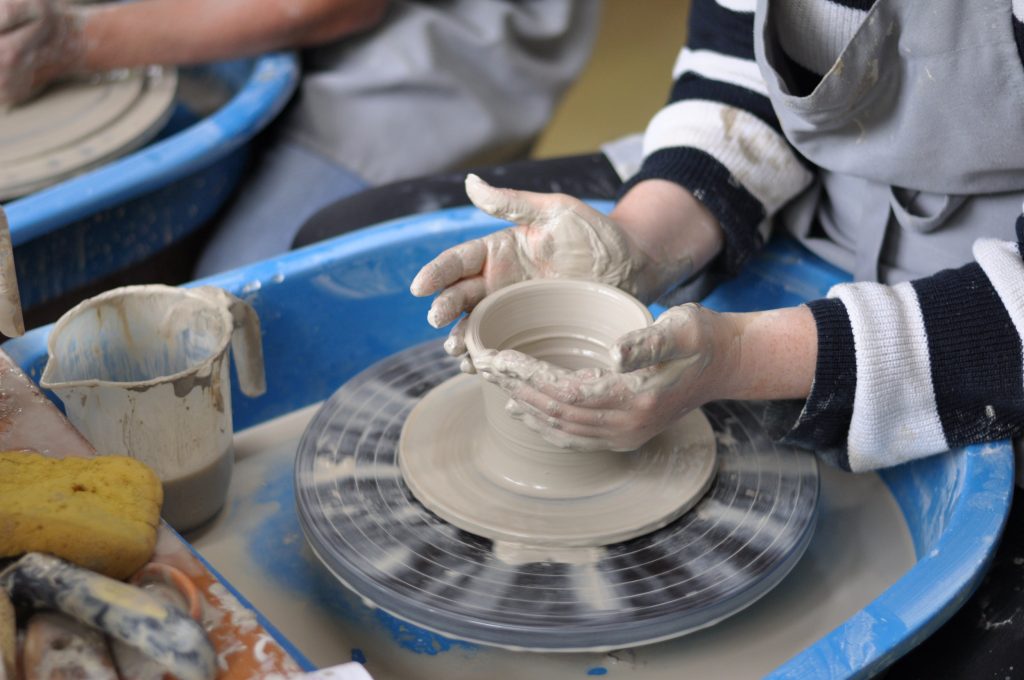 Throwing on the Fitzwilliam wheels at Ashbrook Ceramics.